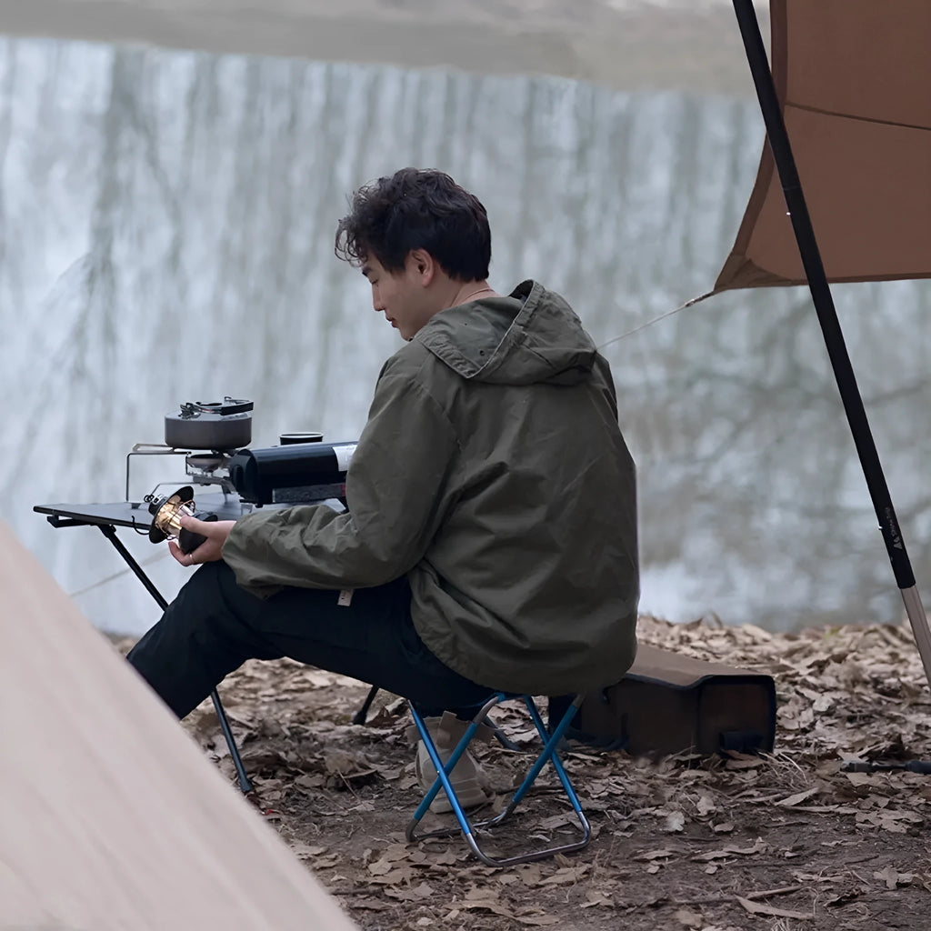 Black aluminium alloy folding camping stool shown in folded and unfolded positions.