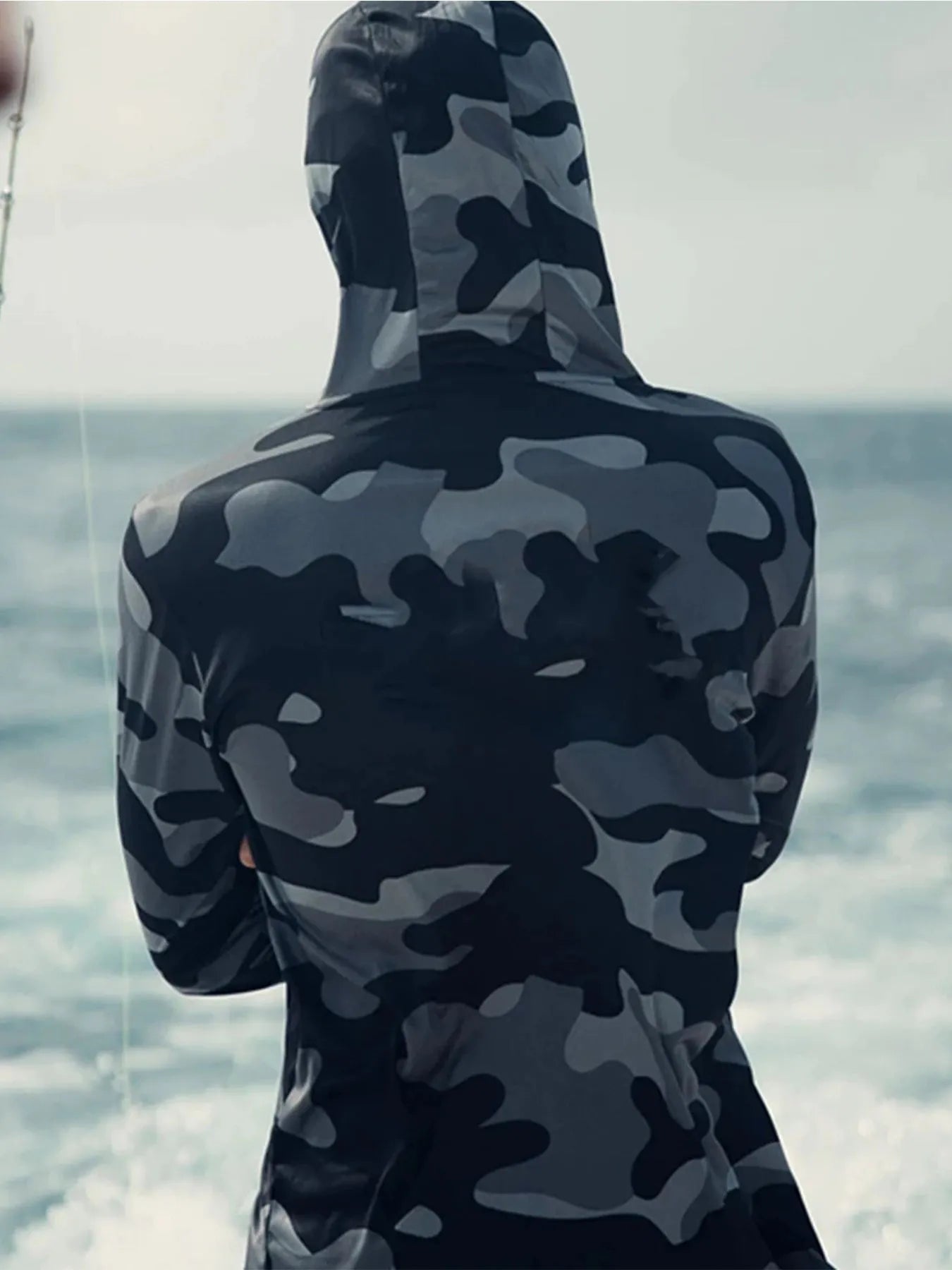 Huk long sleeve fishing hoodie shirt with mesh side panels and UPF 50+ protection.