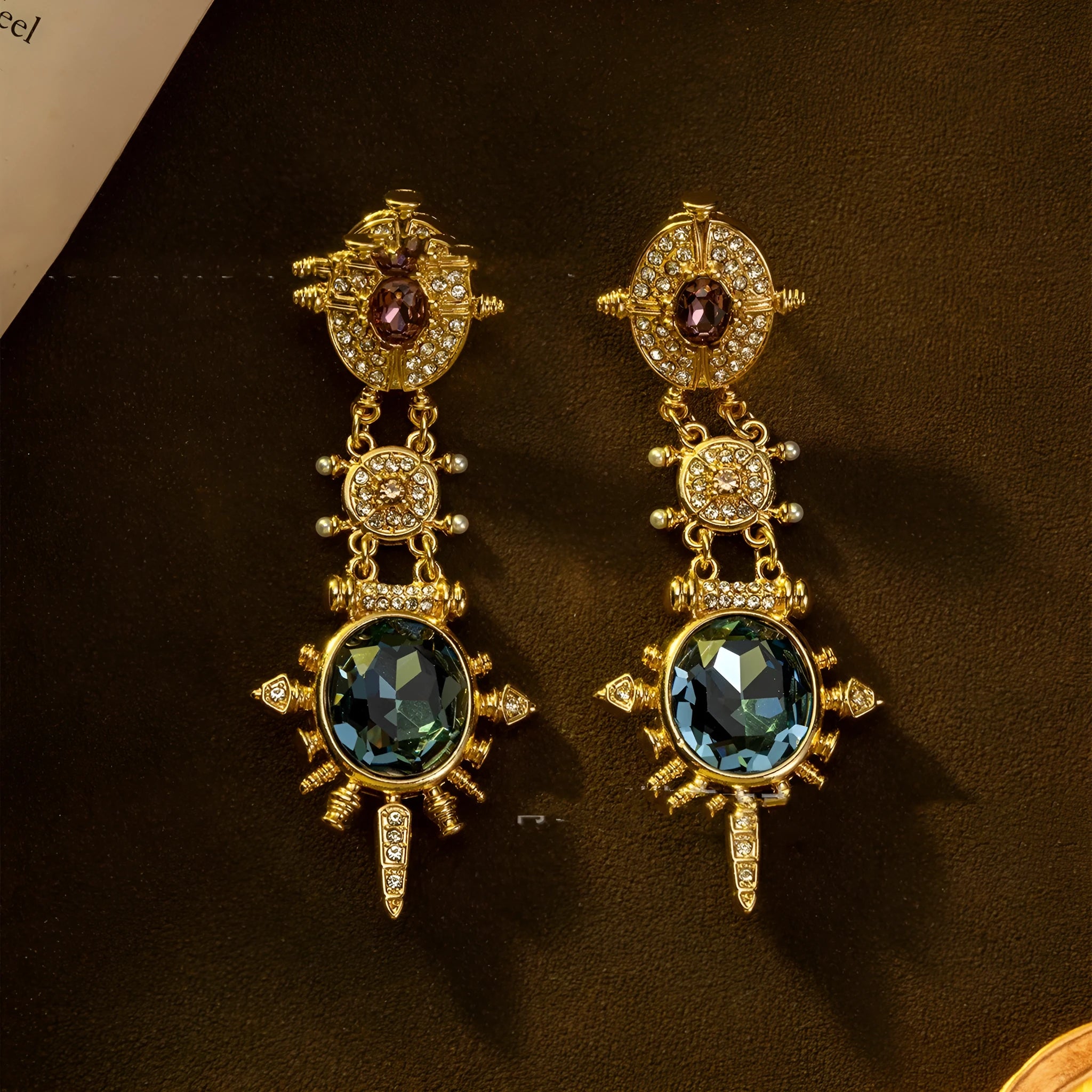 A pair of gold colour geometric round stud earrings with a retro court style design.
