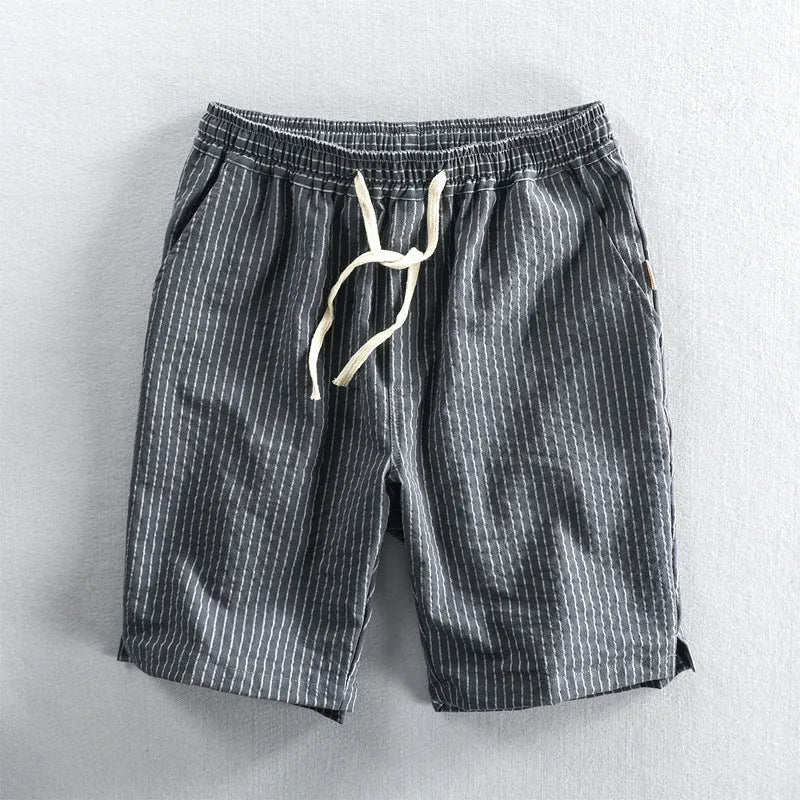 Men's striped cotton casual loose shorts on a hanger showing mid waist and shorts length.