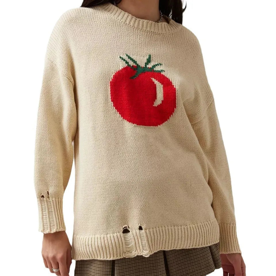 Women's beige loose-fit acrylic Jacquard knit sweater with round neck and long sleeves laid flat.