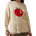 Women's beige loose-fit acrylic Jacquard knit sweater with round neck and long sleeves laid flat.