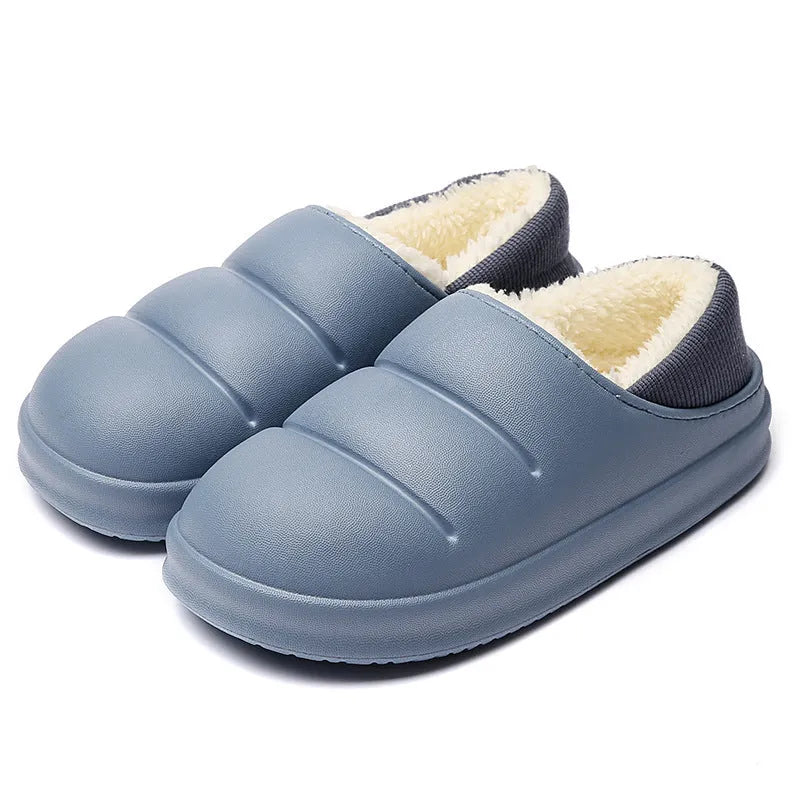 Green EVA waterproof garden slippers with non-slip sole and plush lining shown on wooden decking