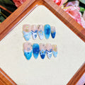 Blue hand-painted fake nails with carved transparent summer ice finish in four sizes