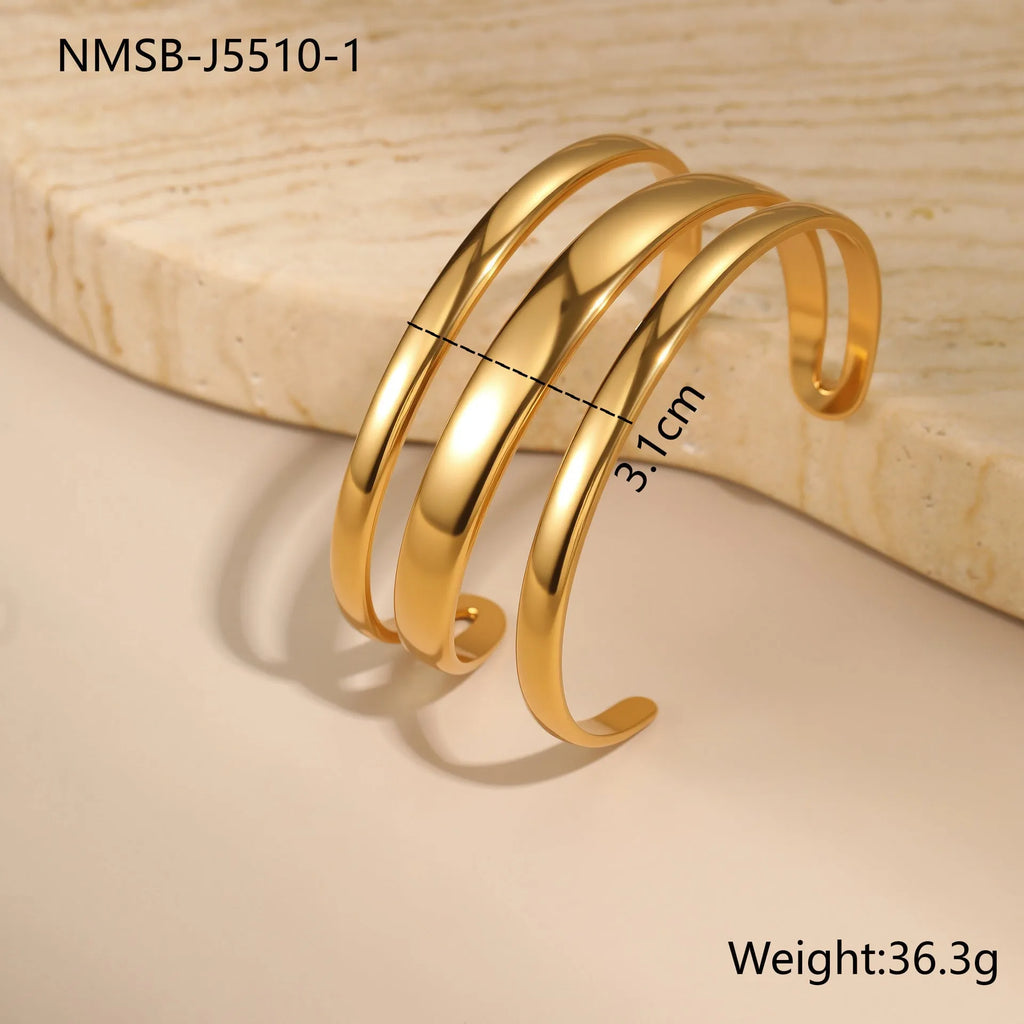 Stainless steel women's bracelet with simple opening clasp and geometric line design in gold electroplated finish