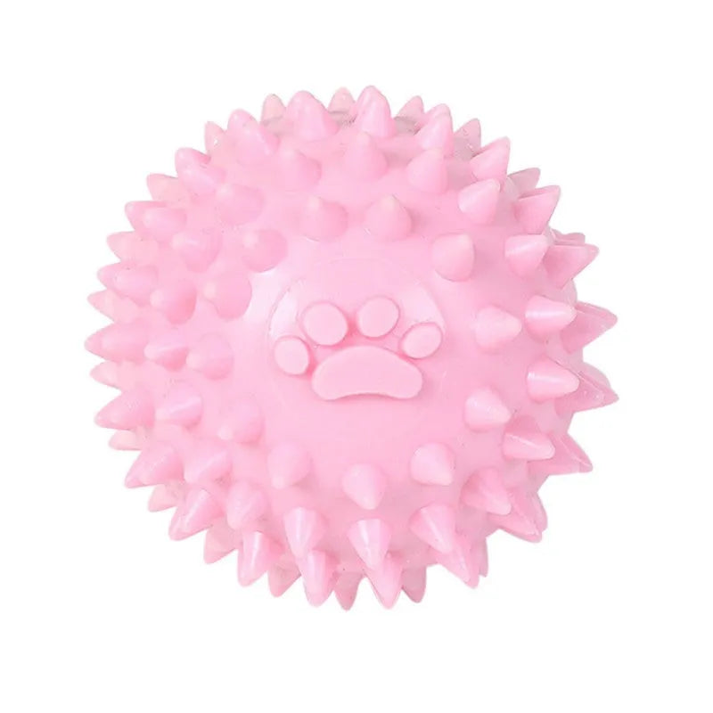 Blue, pink, or yellow TPR dog chewing ball with textured sides for tooth cleaning