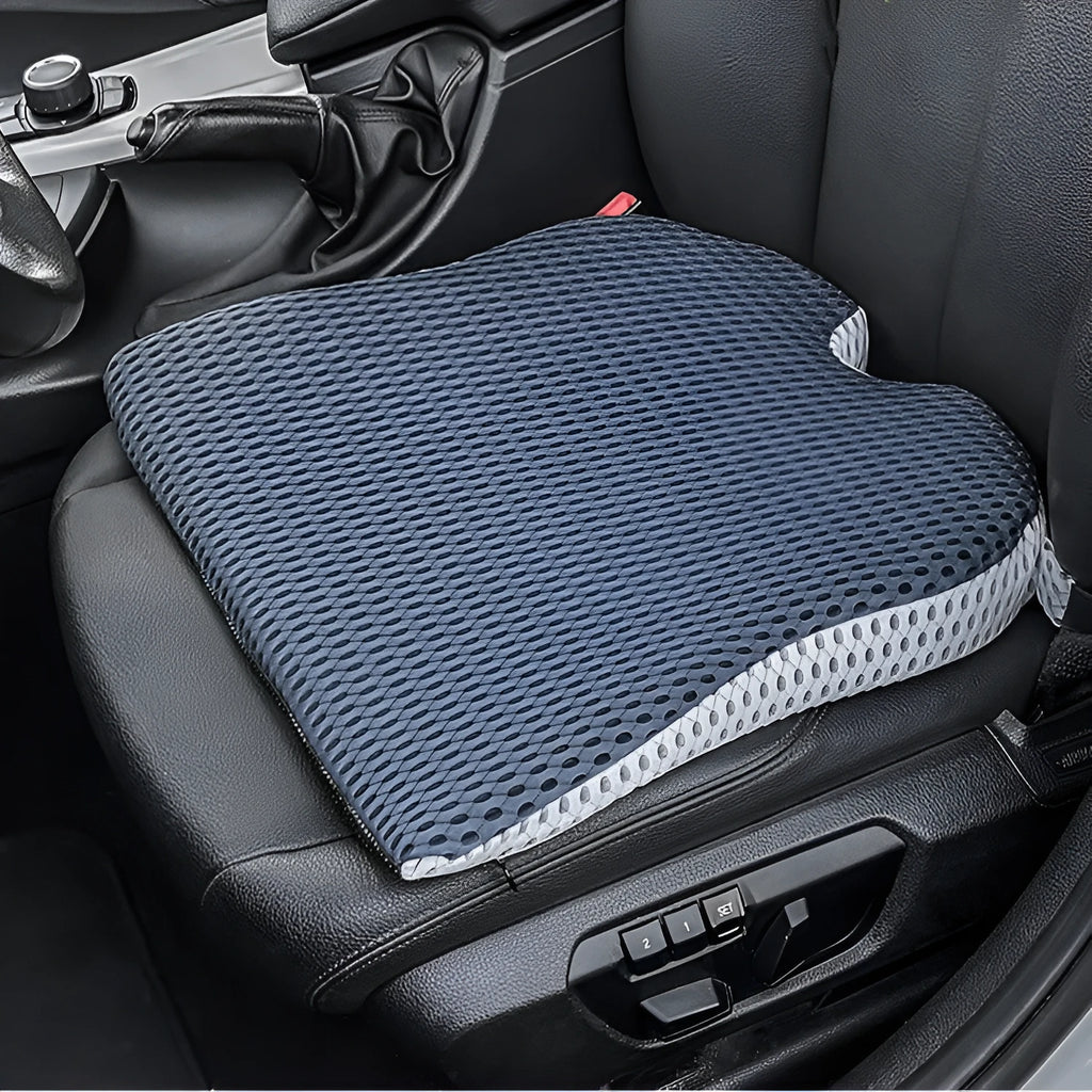 Memory foam seat cushion in grey with elastic strap on a car seat