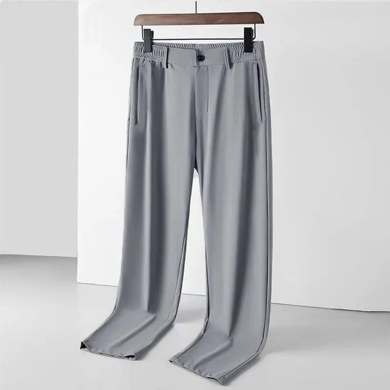 Men's black loose-fit Ice Silk trousers with a straight leg and elasticated waistband.