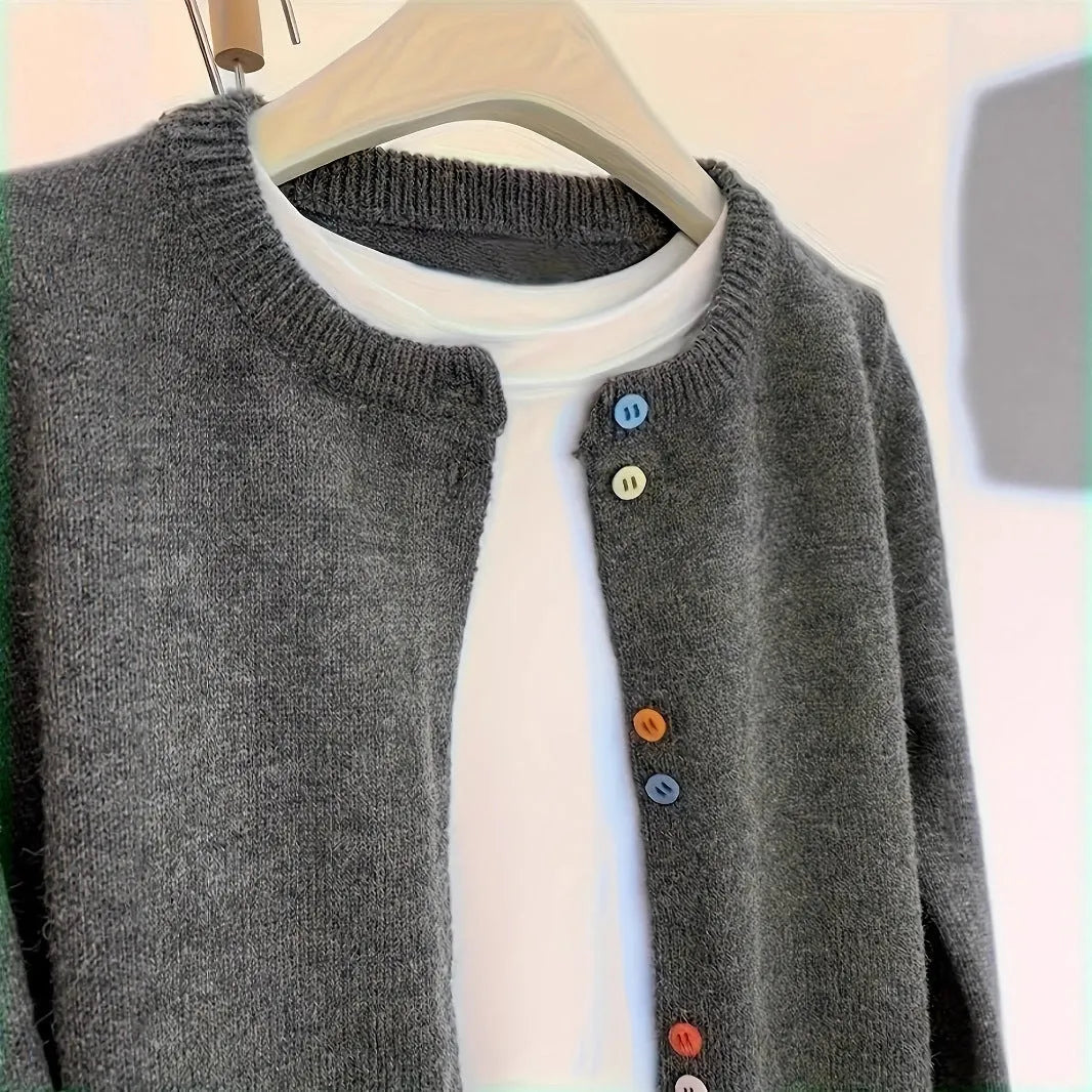 Dark grey women's cardigan sweater with button front and regular sleeves for office commuting