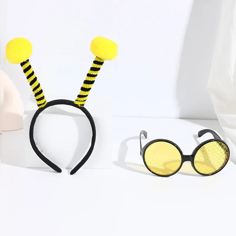 Yellow children's costume headband and glasses set with bee, butterfly, and ladybug patterns.