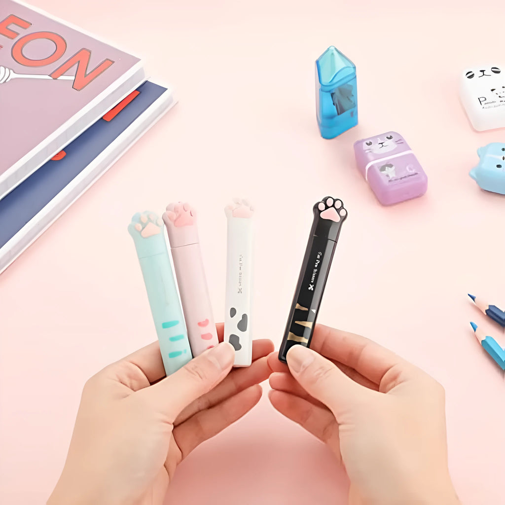Closed pink cat paw mini folding safety scissors showing the cartoon handle design.