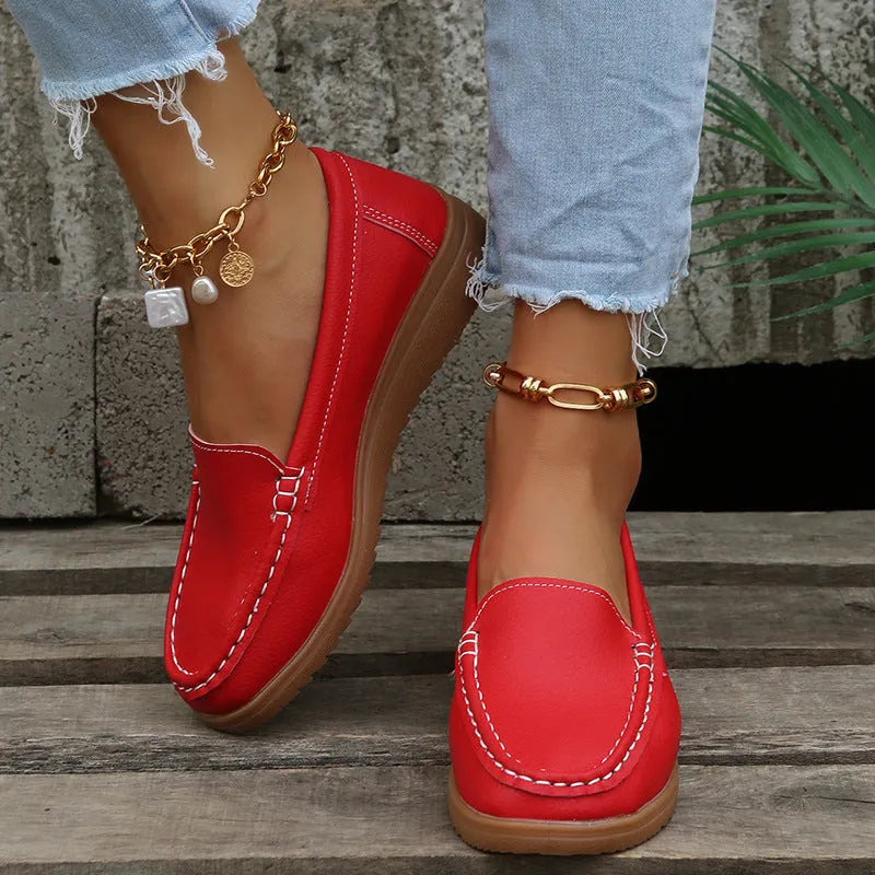 Women's flat loafer shoes in PU leather, showing round toe and car suture detail, on a rubber sole.