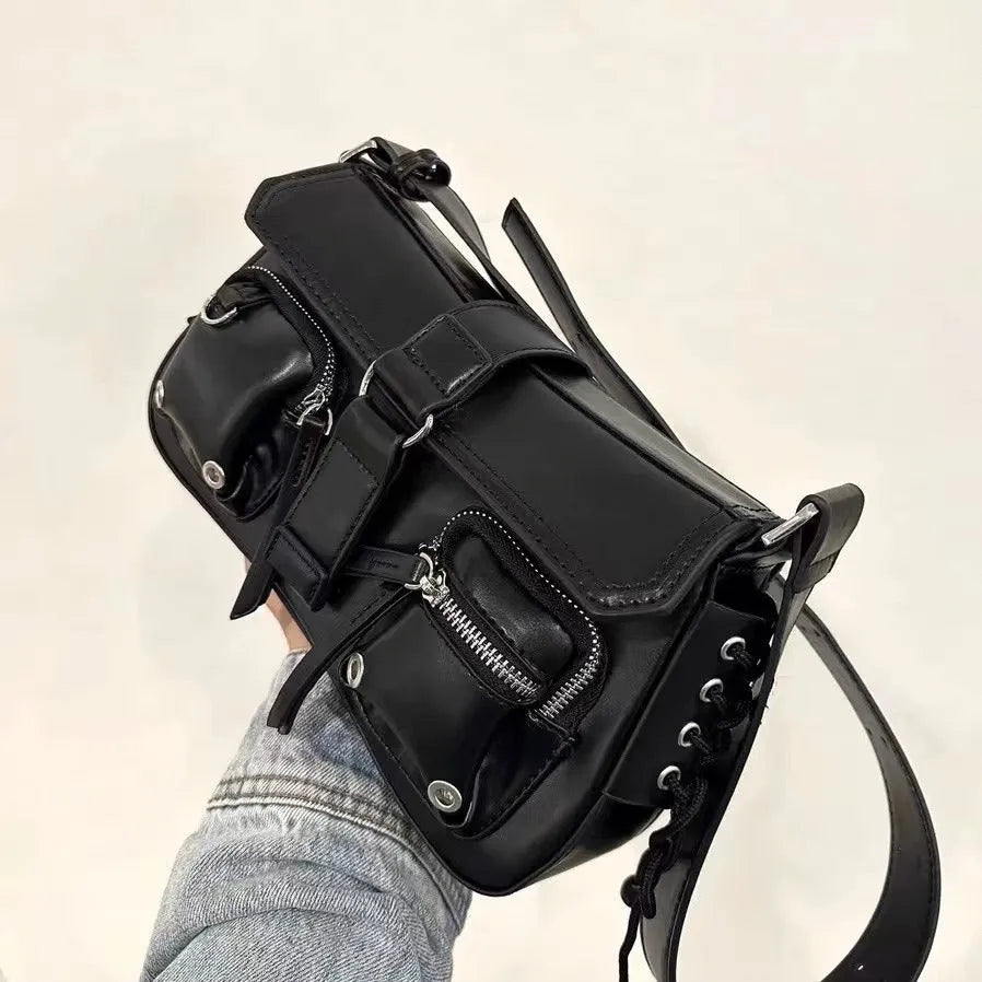 Black PU leather underarm baguette bag with adjustable shoulder strap shown in crossbody position