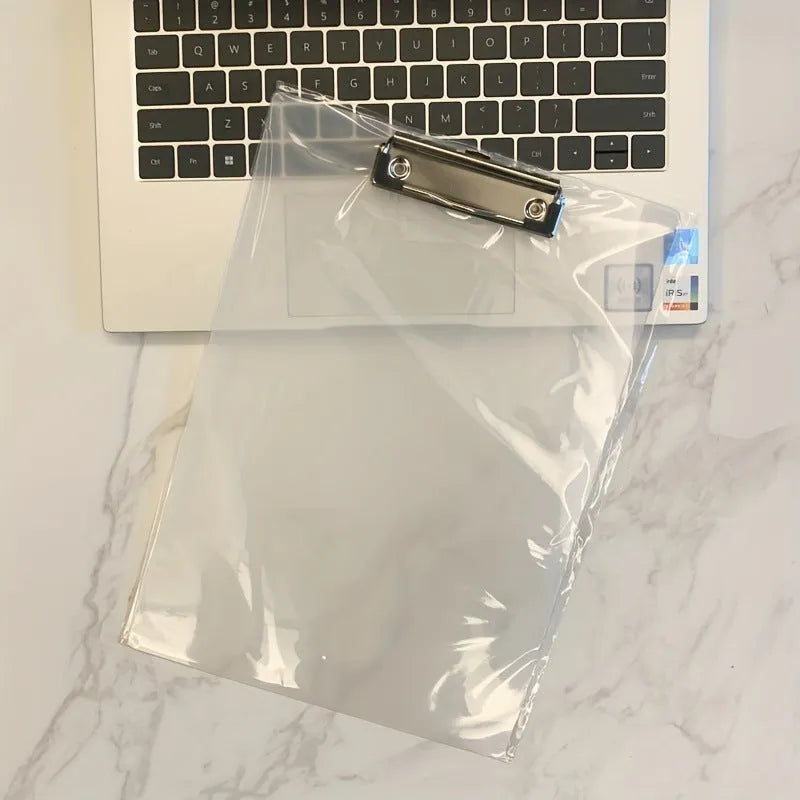 Transparent A4 plastic writing board pad with a silver metal clip, shown in blue colour.