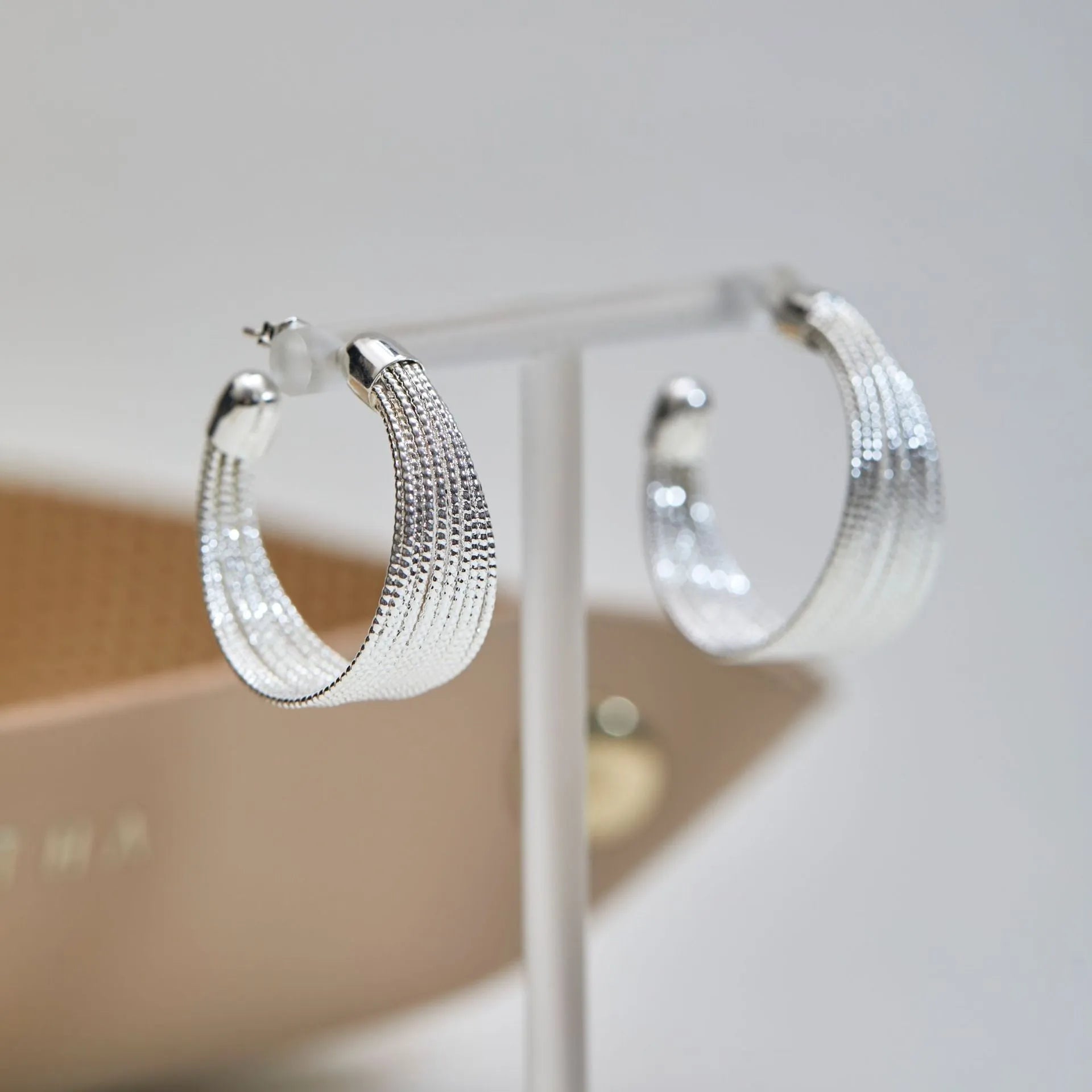 Copper geometric multi-layer bracelet earrings in silver or gold finish, available as clip-on or stud styles