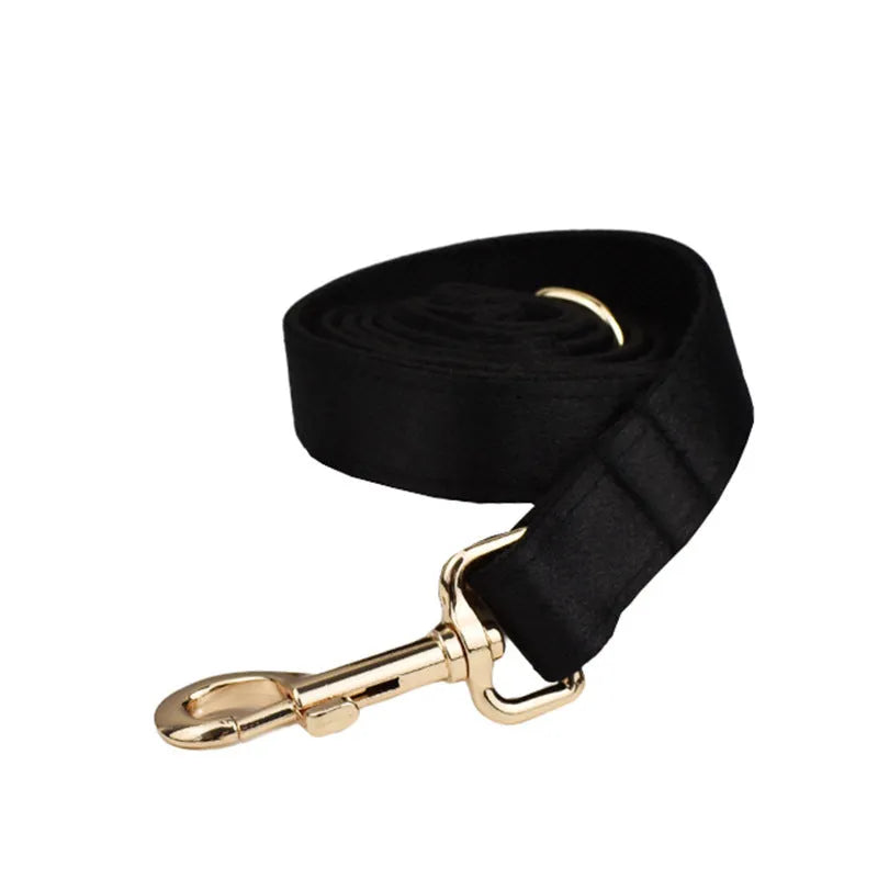 Cloth dog collar, leash, bow, and vest set shown on a model, available in S M L XL sizes.