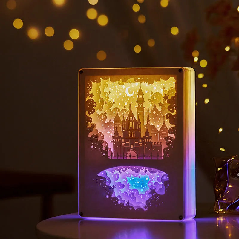 Bedside night light with paper carving design, remote control, and USB power cable