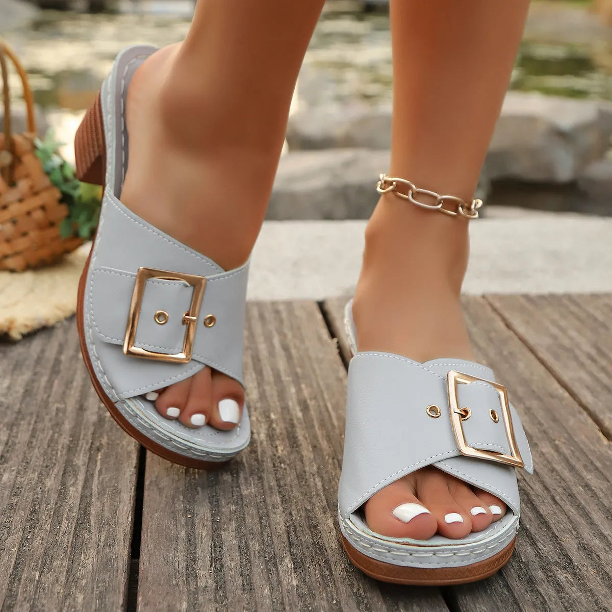Women's black retro chunky heel slippers with a silver metal buckle closure on a round toe.