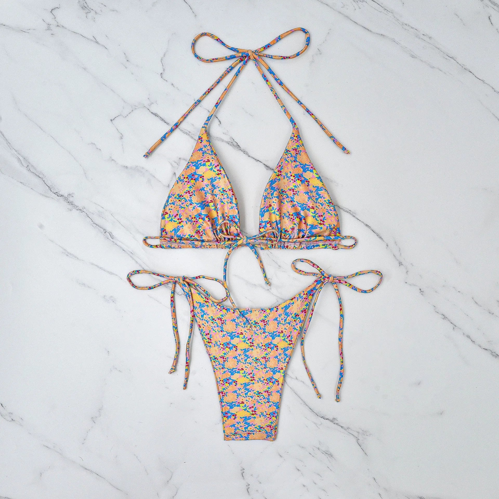 Lace-up bikini swimsuit with backless design and split briefs in polyester fabric