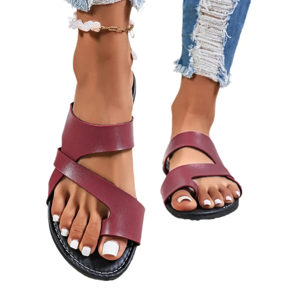 Round head casual beach slippers in black, brown, or wine red with hollow-out design and rubber soles