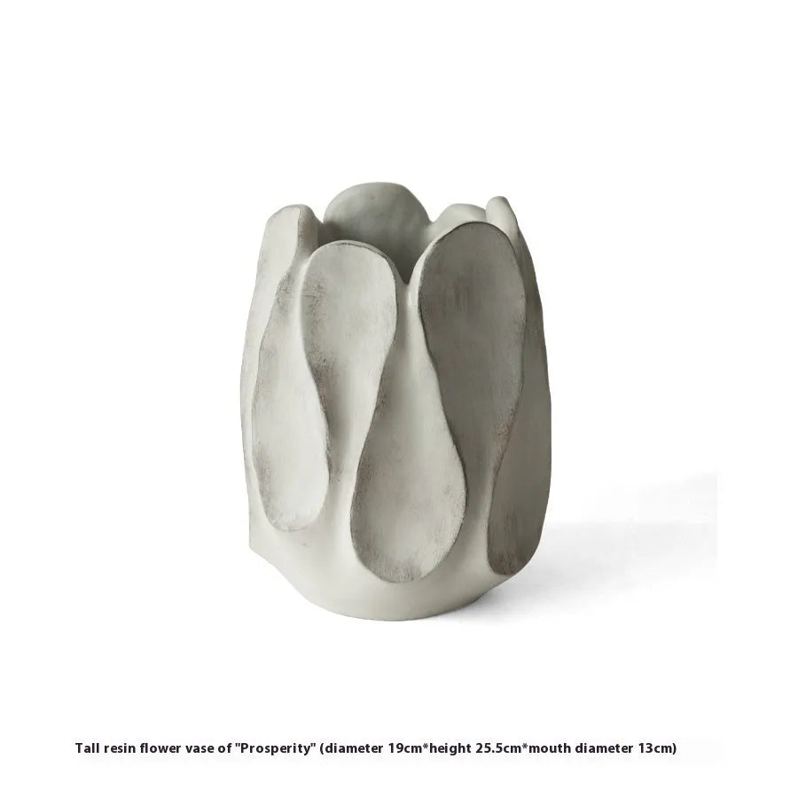 Irregular ceramic art vase in magnesium clay with resin decorative elements for floral arrangements