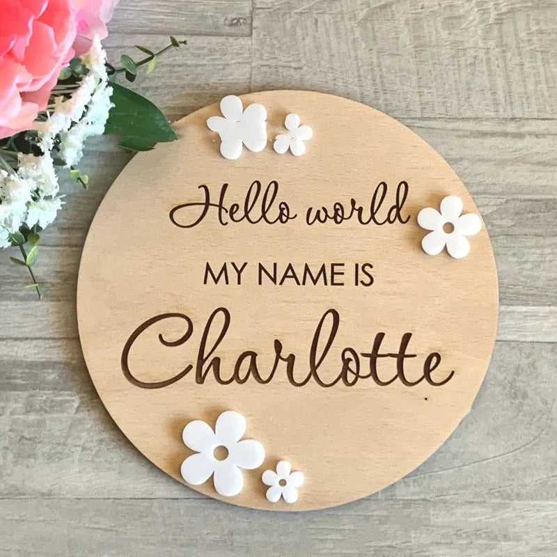 Square wooden baby name plaque showing birth information, 15cm on each side.