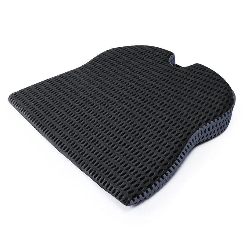 Memory foam seat cushion in grey with elastic strap on a car seat
