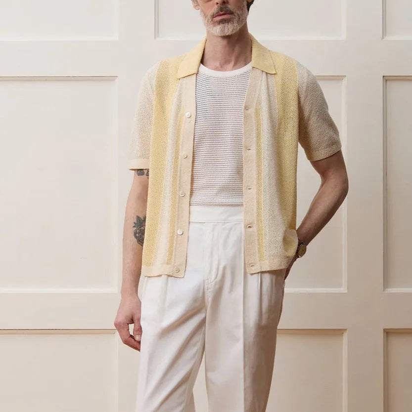 Yellow short-sleeved polo shirt with hollow-out asymmetric design detail on Tencel fabric