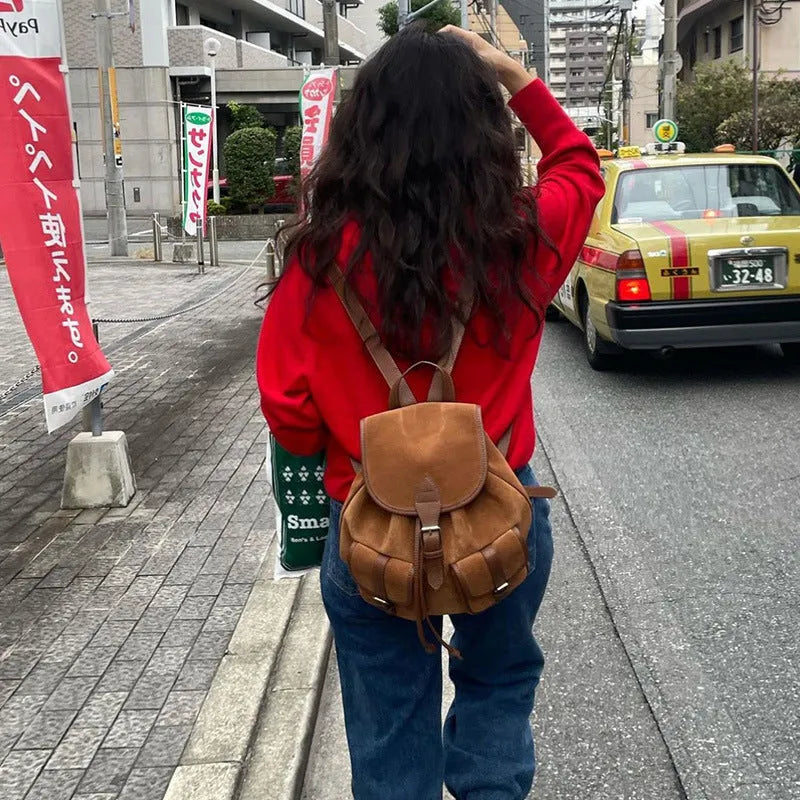 Women's light brown velvet frosted backpack with flap closure and double shoulder straps