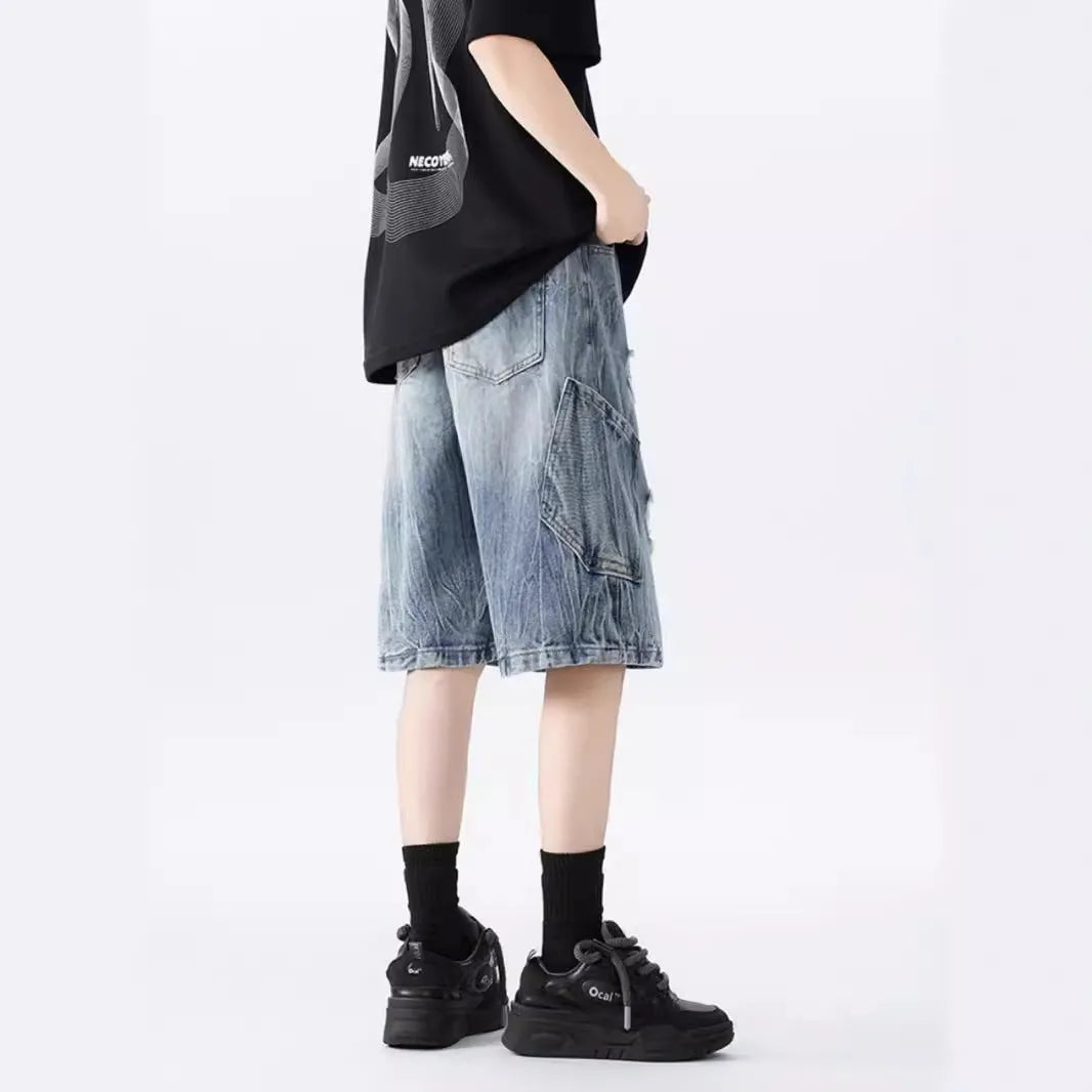 Men's loose-fit washed ripped denim shorts in black and blue colours with distressed detailing and retro styling