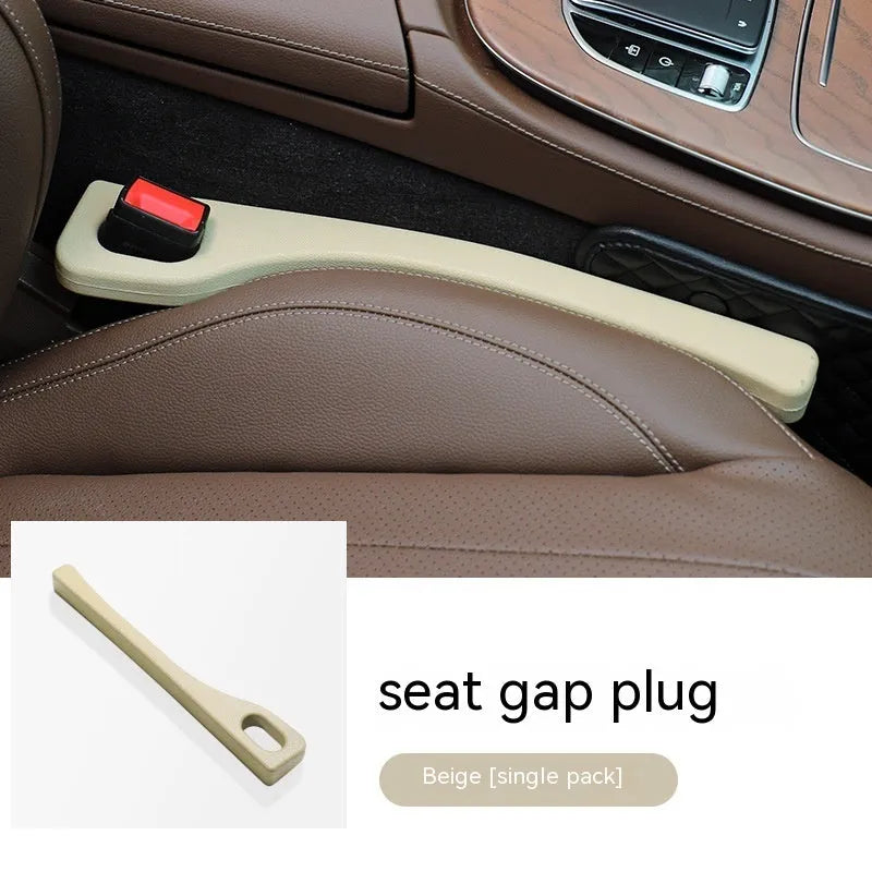 Flexible polyurethane car seat gap strip in black colour lying next to a car seat.