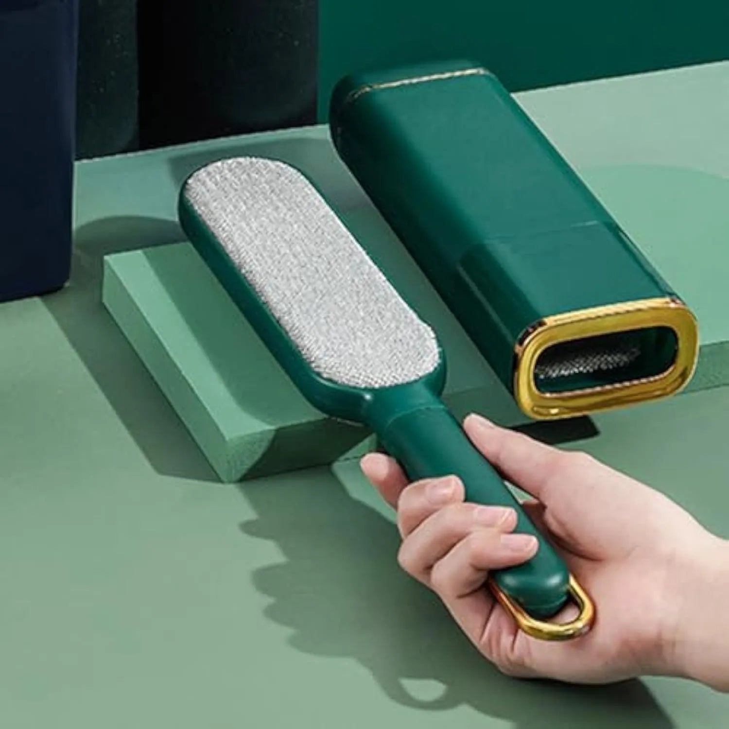 Double-sided pet hair remover brush in blue, green or white with storage box base