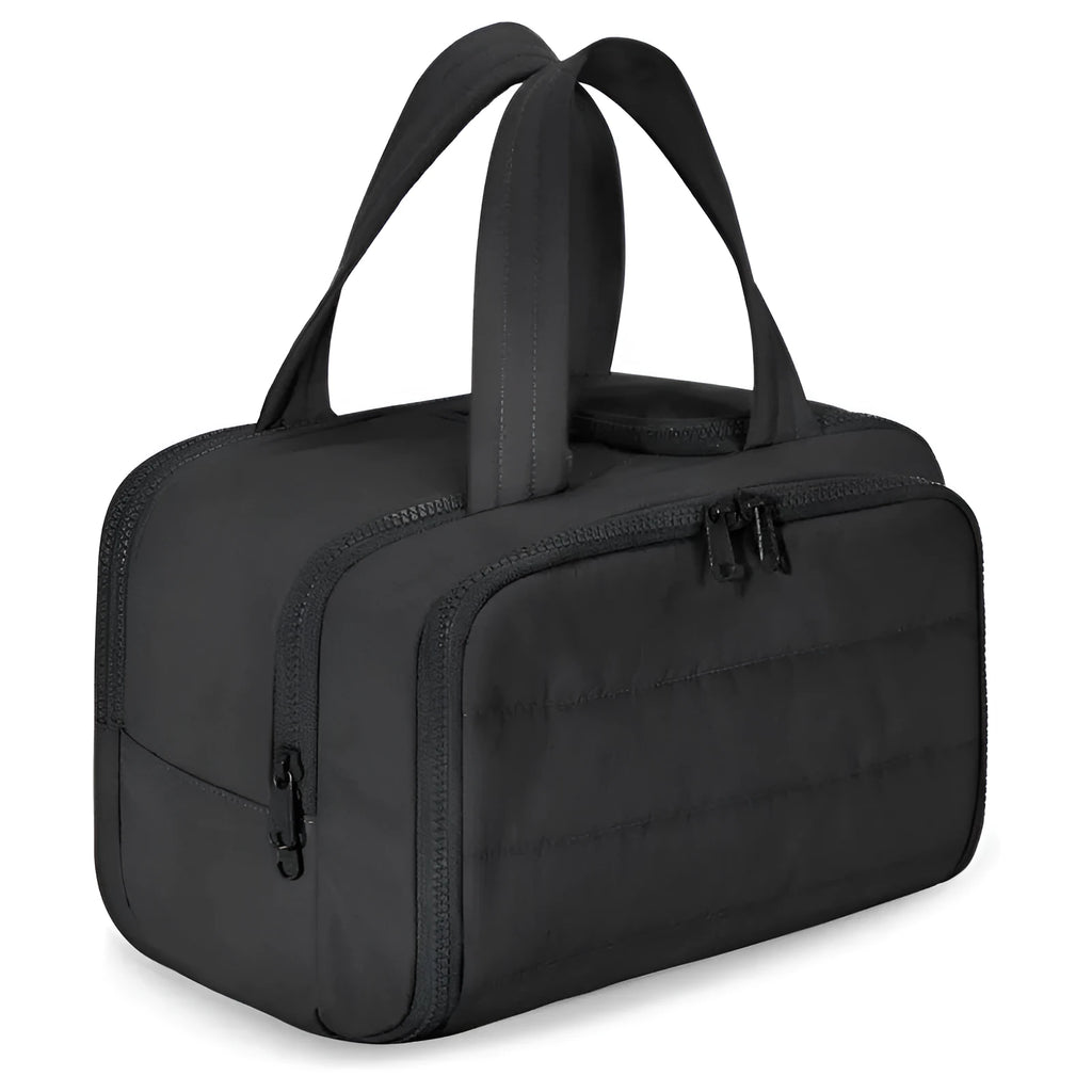 Large open-top travel toiletry bag in black polyester with fluffy texture, showing ample storage space.