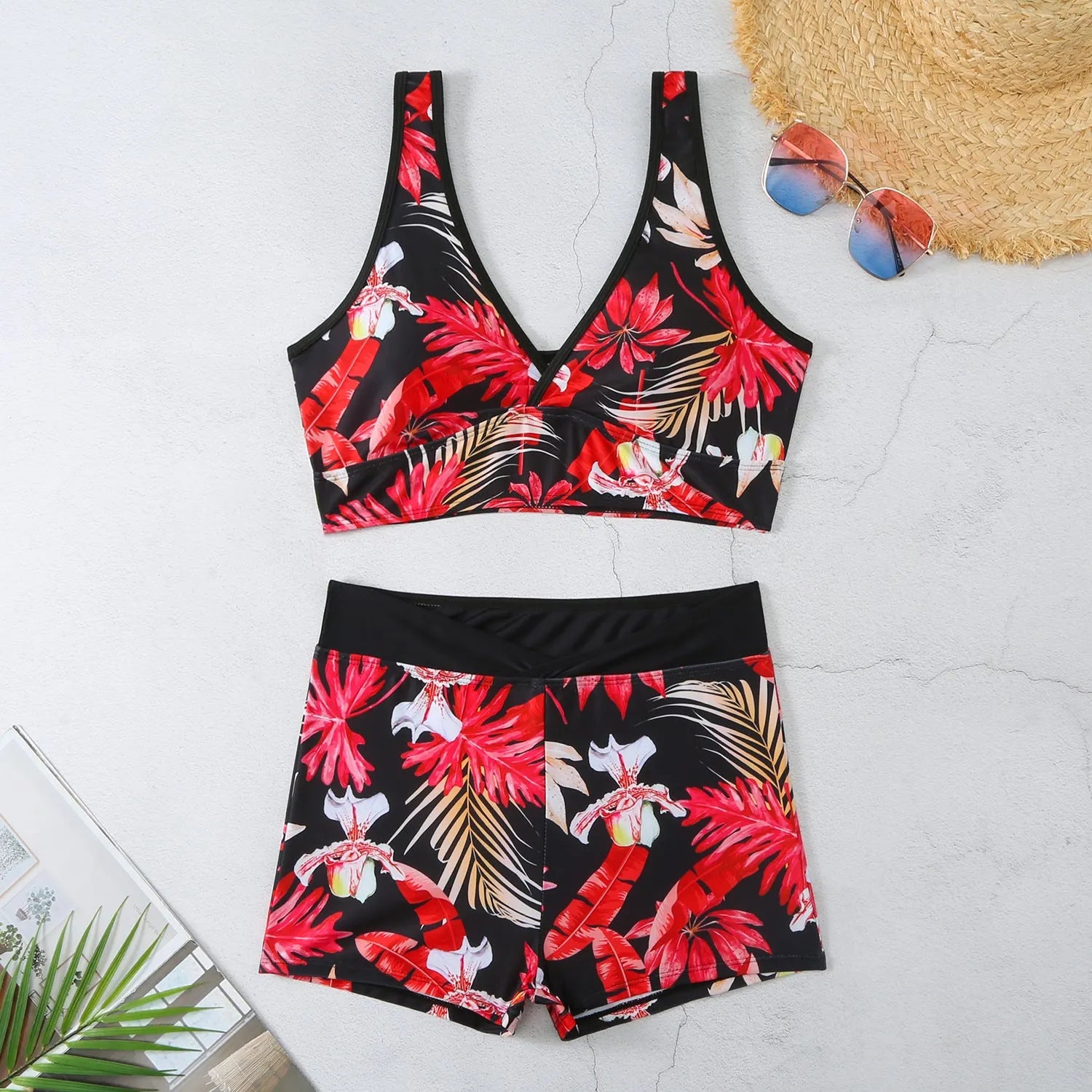 Women's two-piece printed swimsuit set with sleeveless top and boxer shorts in a multi-colour design.