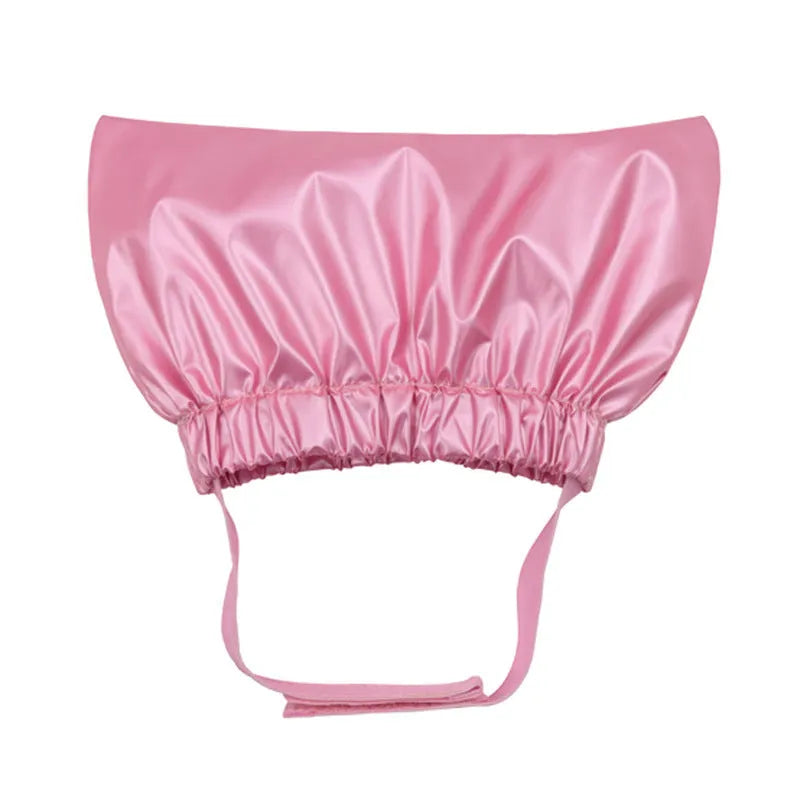 A silver waterproof shower cap for dogs and cats, shown adjusted to fit over pet ears.