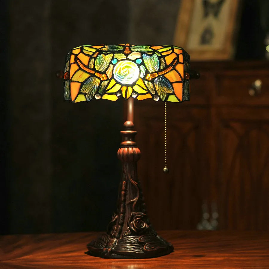 10-inch Tiffany style stained glass table lamp with resin base on a wooden desk.