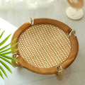Brown square woven rattan pet hammock bed for cats and small dogs on a wooden floor.