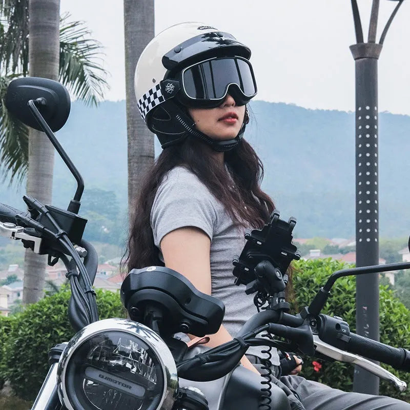 Retro open face motorcycle helmet in matte black, shown from the side on a grey background.
