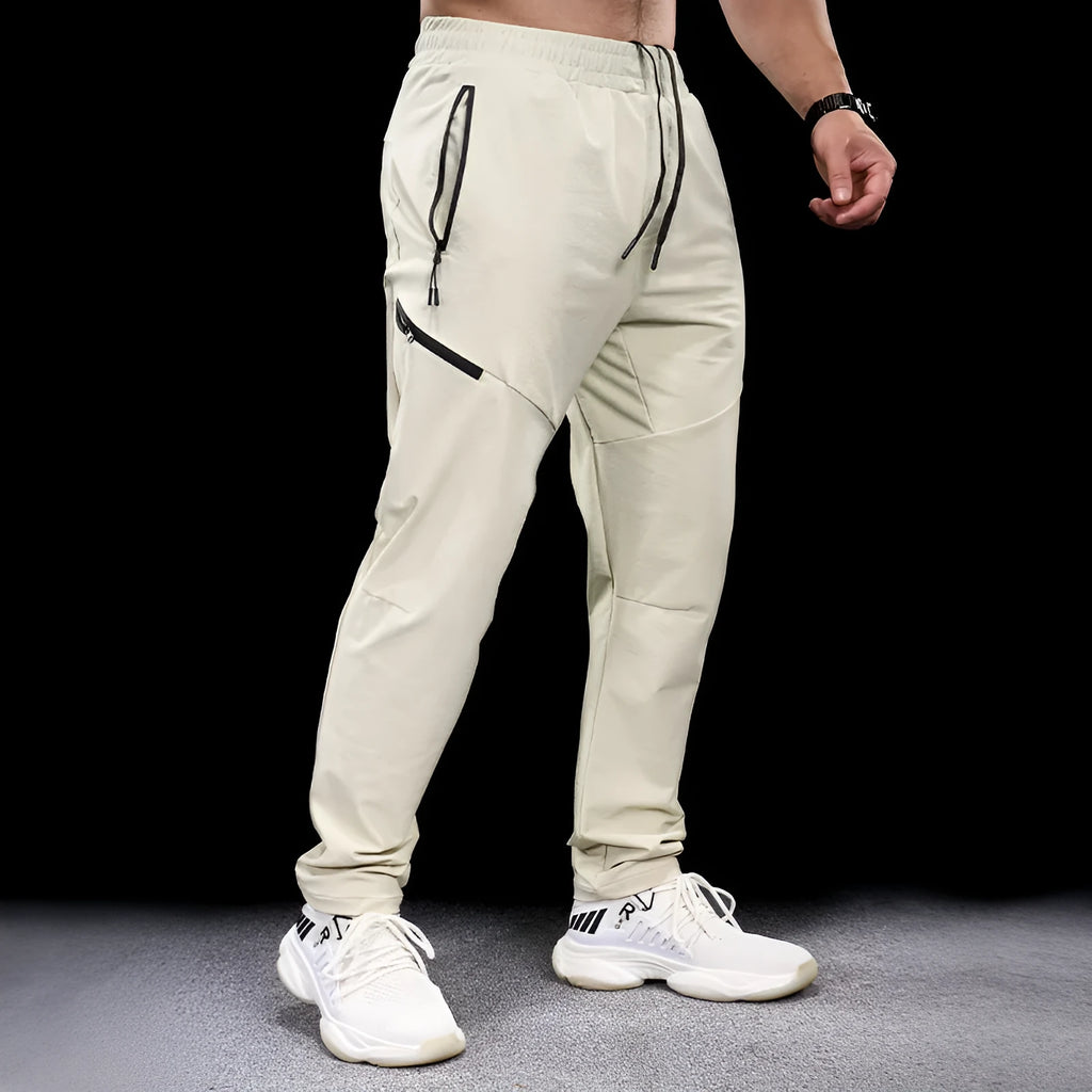 Men's black waterproof quick-drying nylon workout trousers for sports and exercise