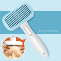 Blue automatic pet hair removal comb for dogs and cats on a table.