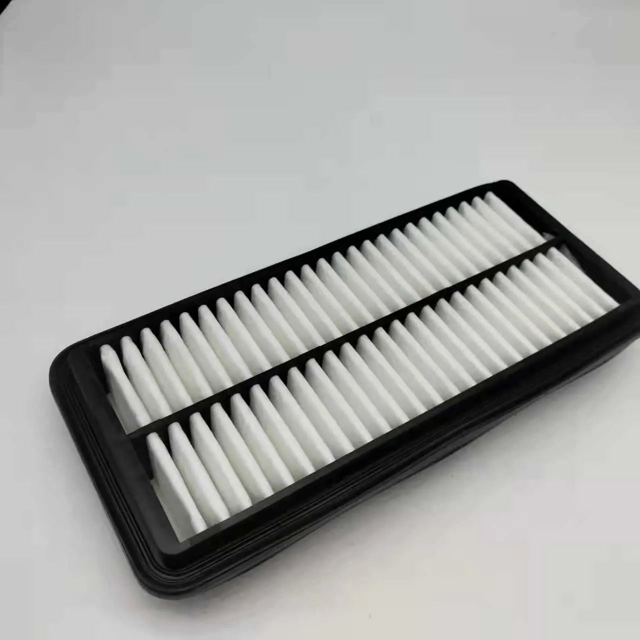 Black rectangular car air filter measuring 256mm by 113mm by 40mm