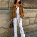 European and American retro style loose fit solid colour polyester jacket with long sleeves.
