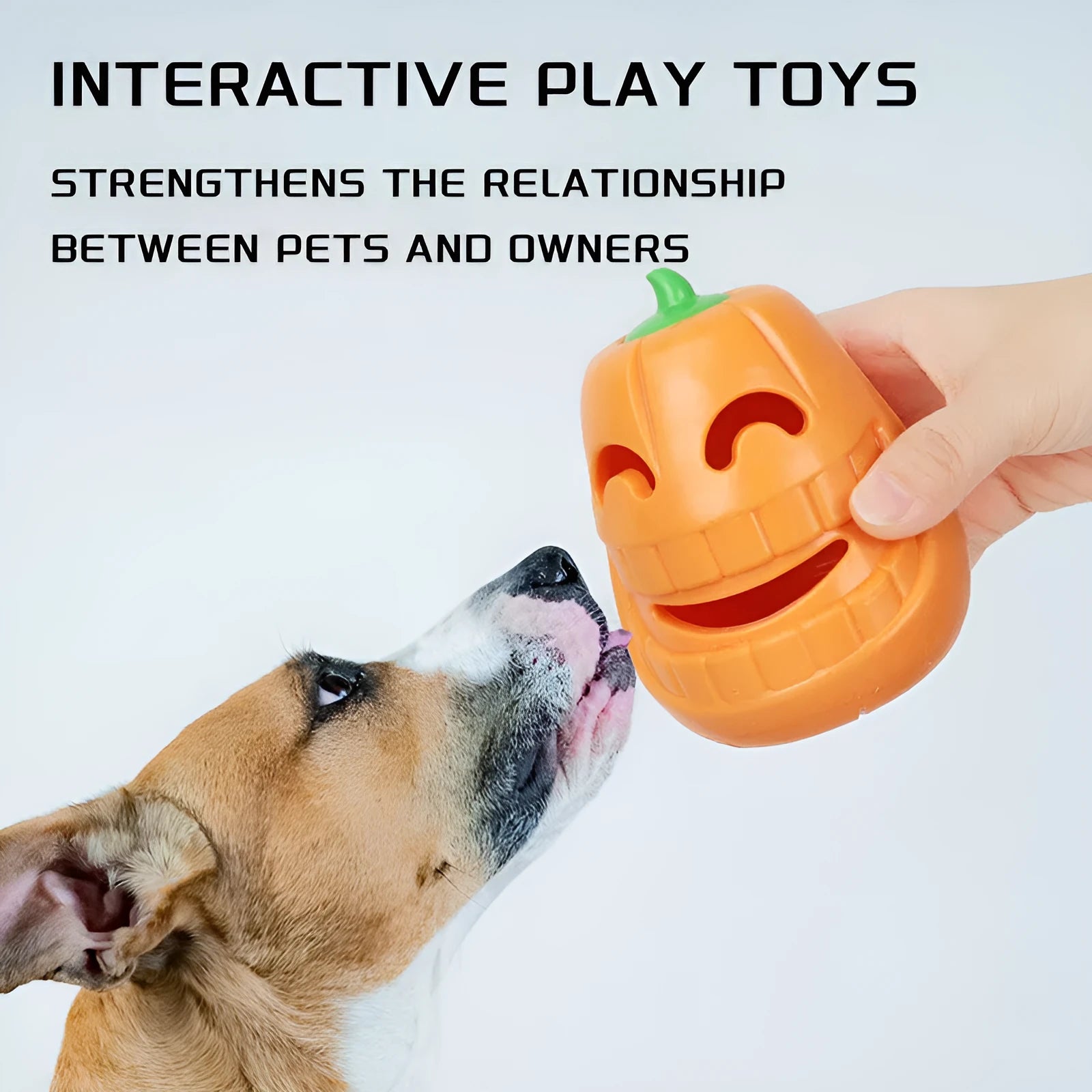 Halloween pumpkin shaped orange interactive dog chew toy with treat-dispensing funnel
