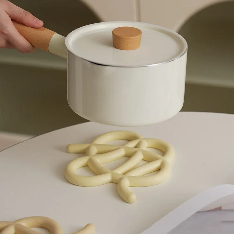 Ceramic heat proof mat with irregular shape and bend and hook design