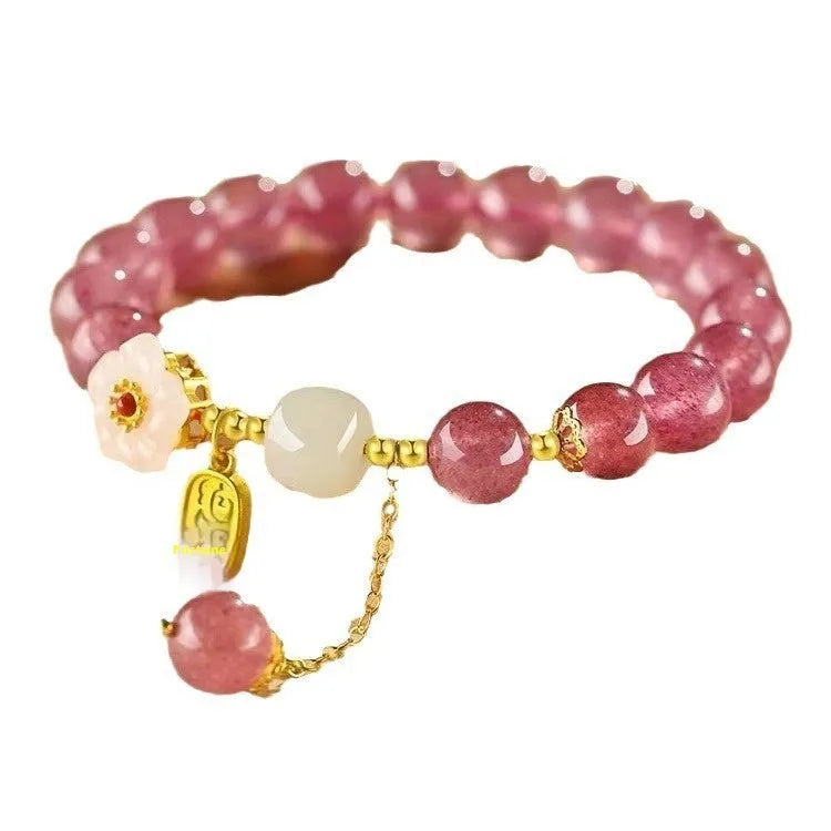 Handmade natural strawberry quartz crystal bracelet for women with moon and pearl bead designs.