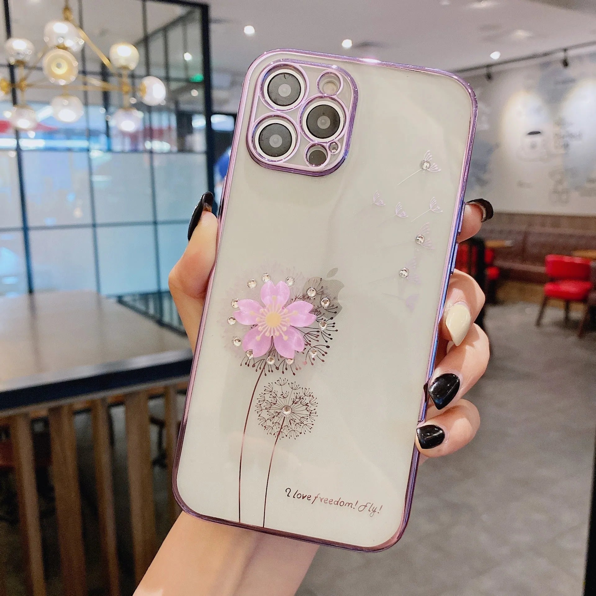 Green silicone iPhone case with a 3D floral design and a built-in spin stand on a white background.