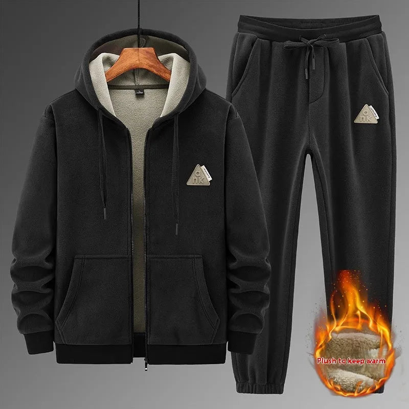 Man wearing a grey hooded sweater and matching trousers from a men's two-piece casual sports suit set.