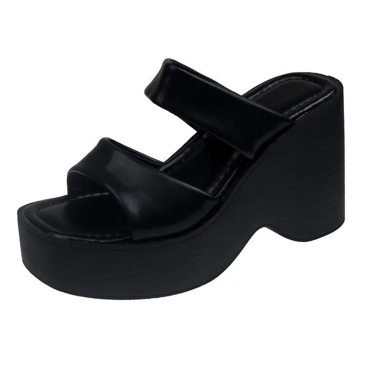 Women's black wedge platform slippers with square toe and PU upper.