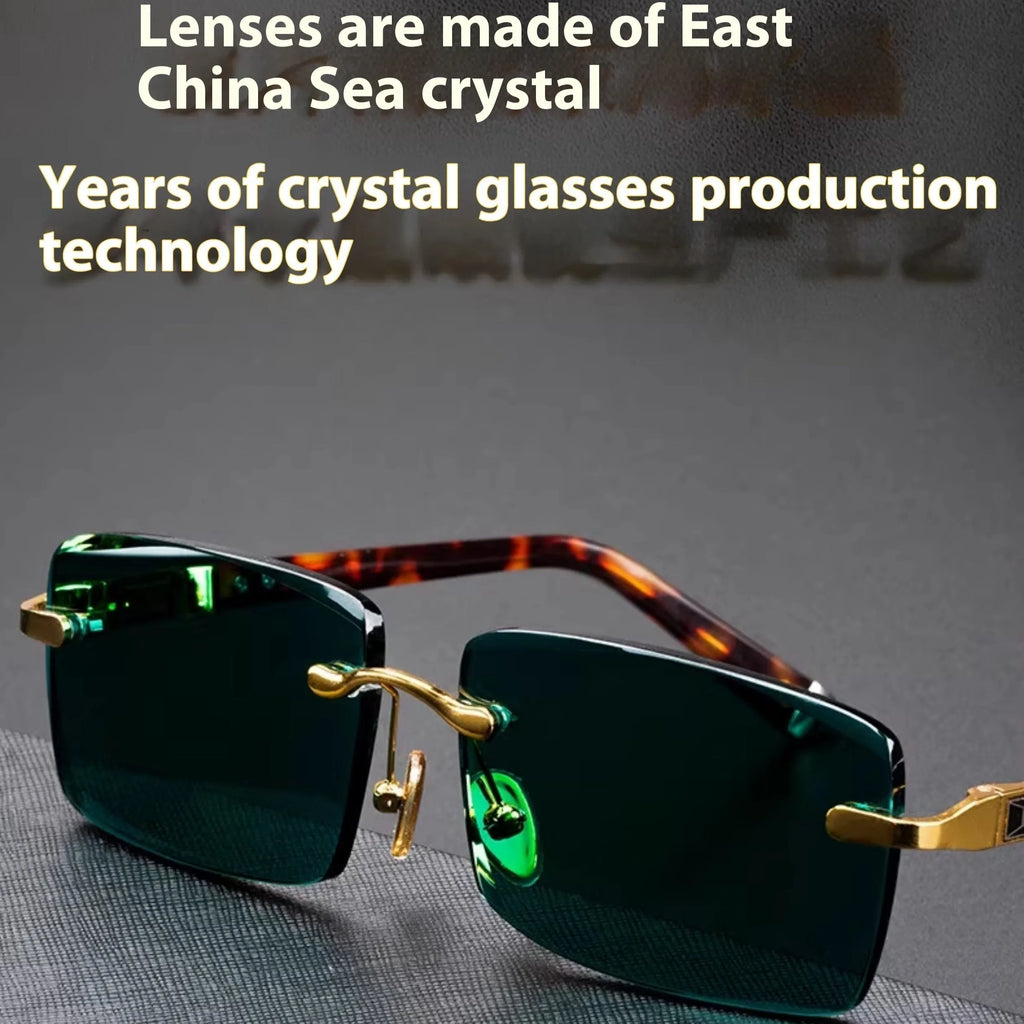 Dark green frameless crystal sunglasses with a glasses case and lens cloth.