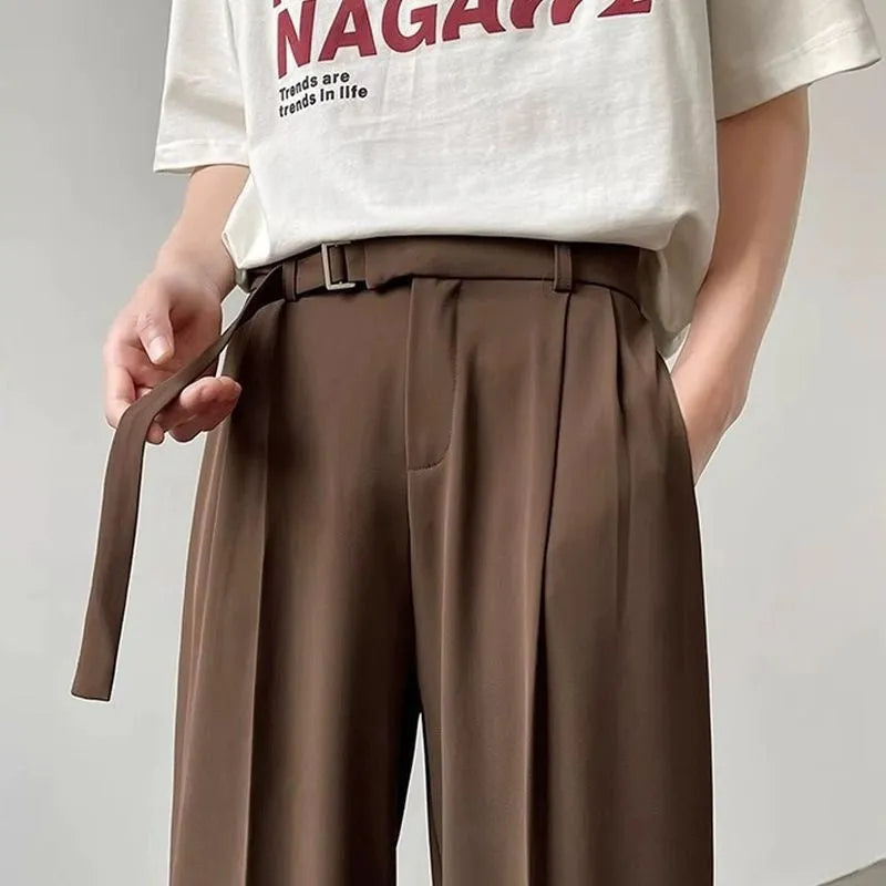 Black wide leg trousers with straight leg opening and loose fit casual style